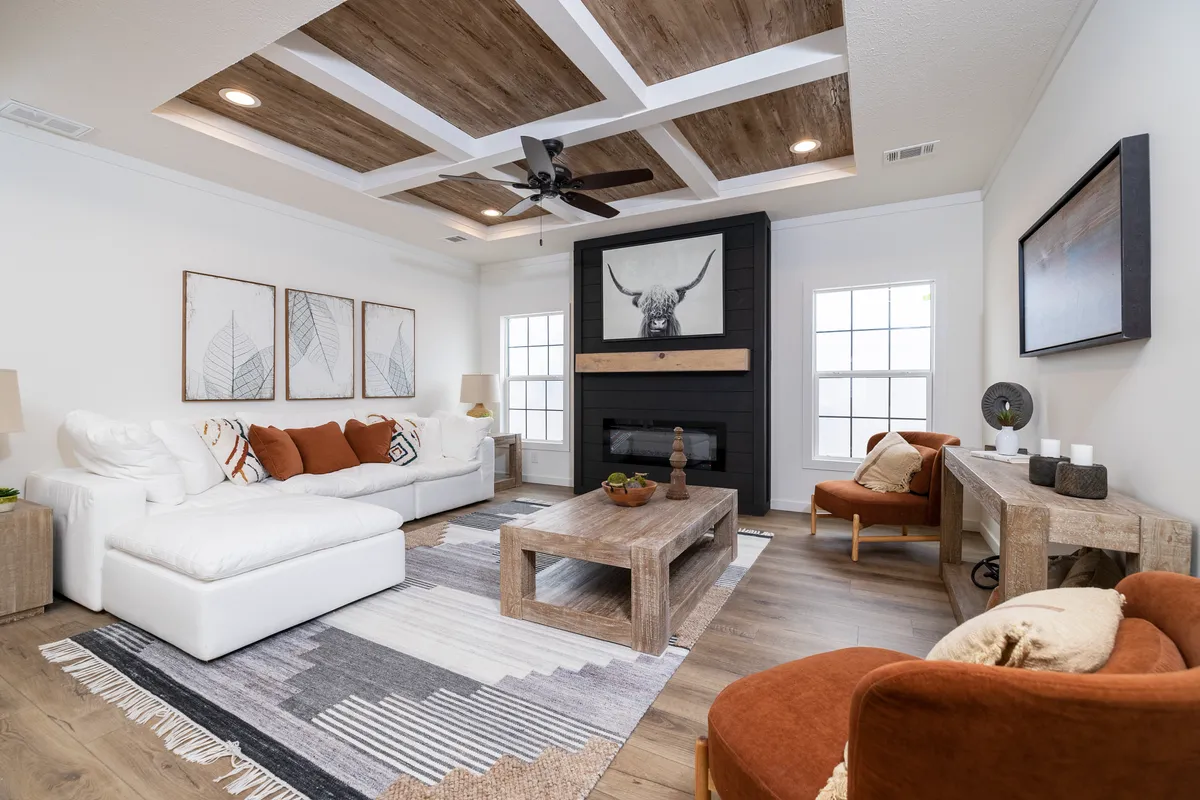 376cdf1f-ebb4-40d7-b7df-3be45c57b944 A living room with a wood ceiling and white furniture.