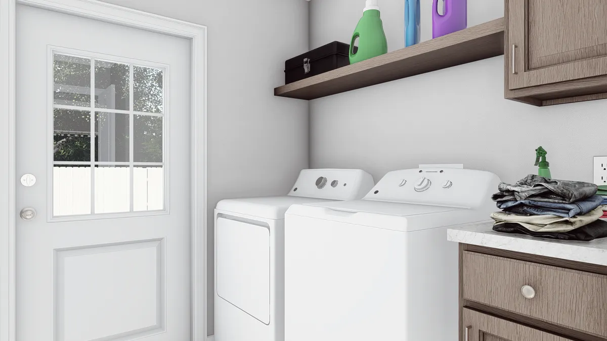39faadc9-7a92-4f92-aabc-284d04db805e A laundry room with a washer and dryer.
