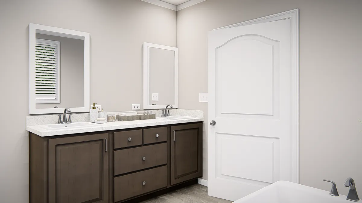 A bathroom with two sinks and a tub.