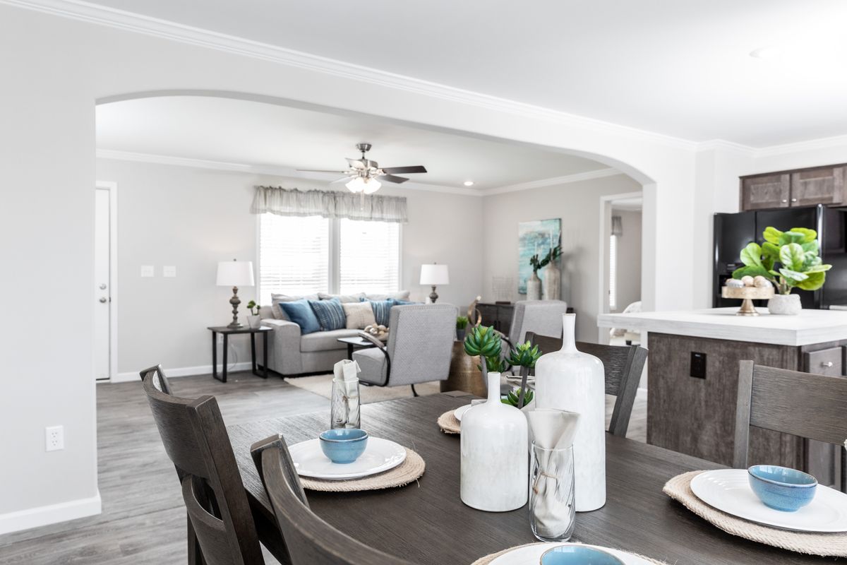 4e8b4e86-761f-4679-ad17-01e7d10ceca4 A living room and dining room in a home.