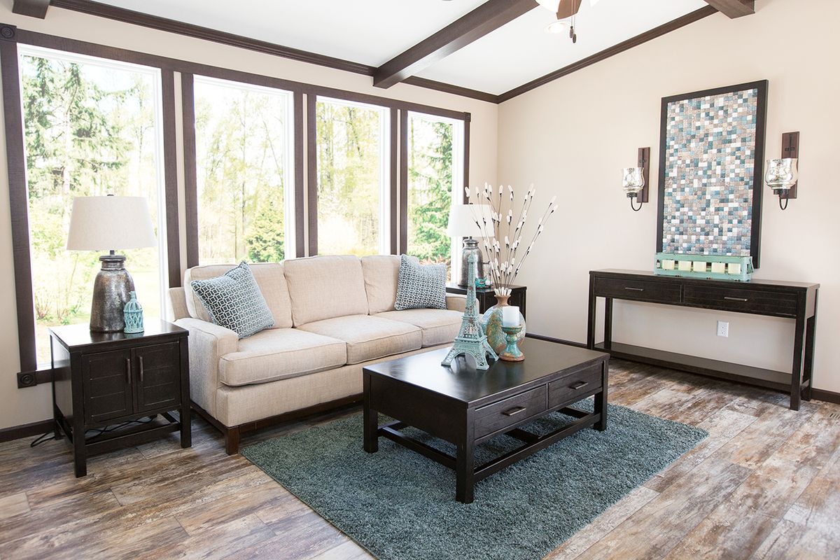 null A living room with hardwood floors and a coffee table.