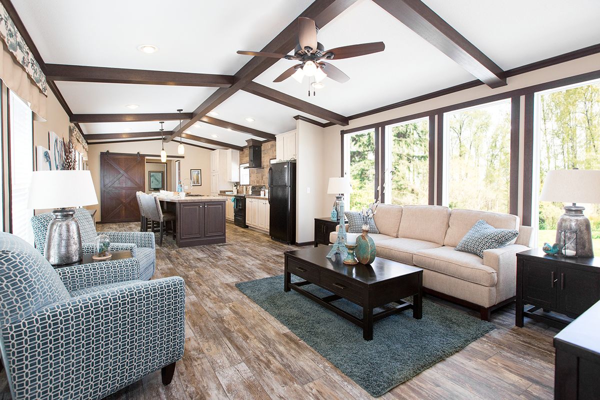 null A living room with hardwood floors and a ceiling fan.