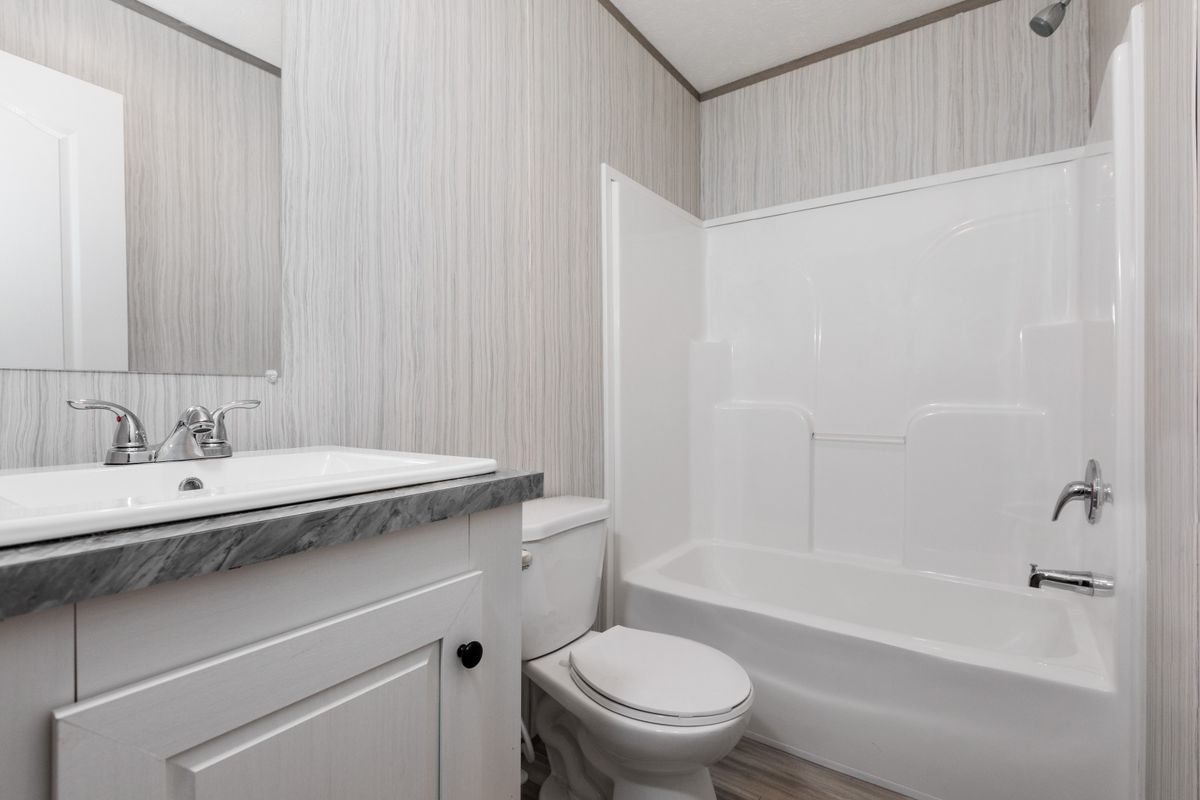 65a25b56-a47d-4688-ae82-15c3136de40c White bathroom, toilet, sink