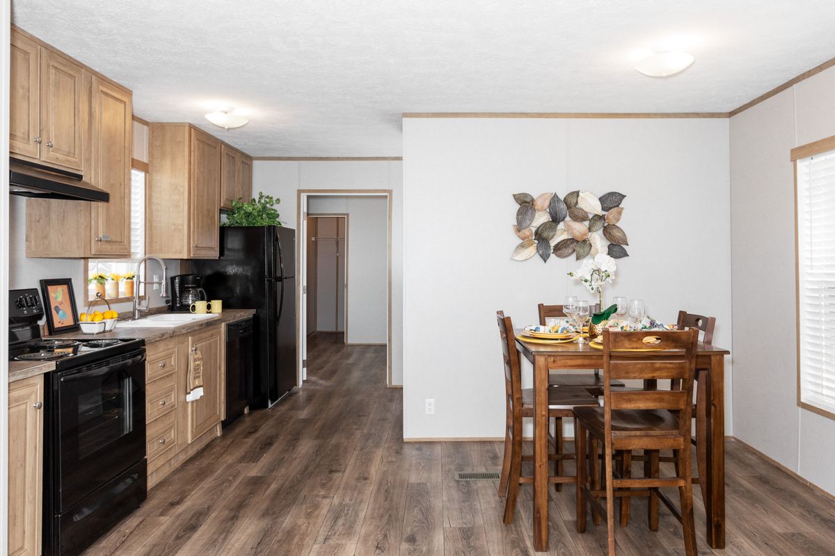 A kitchen and dining area in a mobile home.