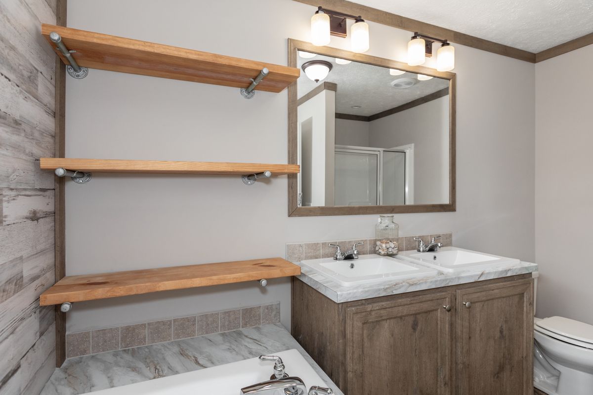 A bathroom with shelves.