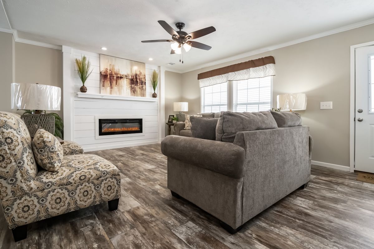 8ccda8ae-c284-41d0-ba98-4d039a541214 A living room with hardwood floors and a fireplace.