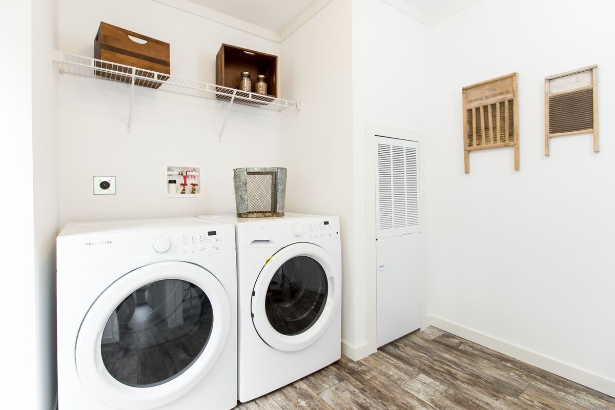 A laundry room with a washer and dryer.