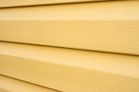 Yellow vinyl siding