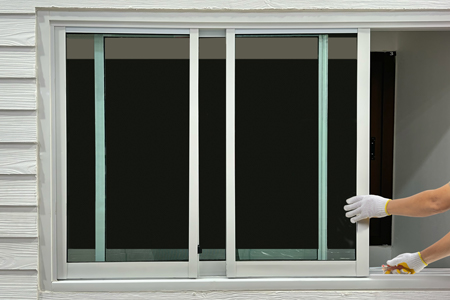 Man installing a slider window