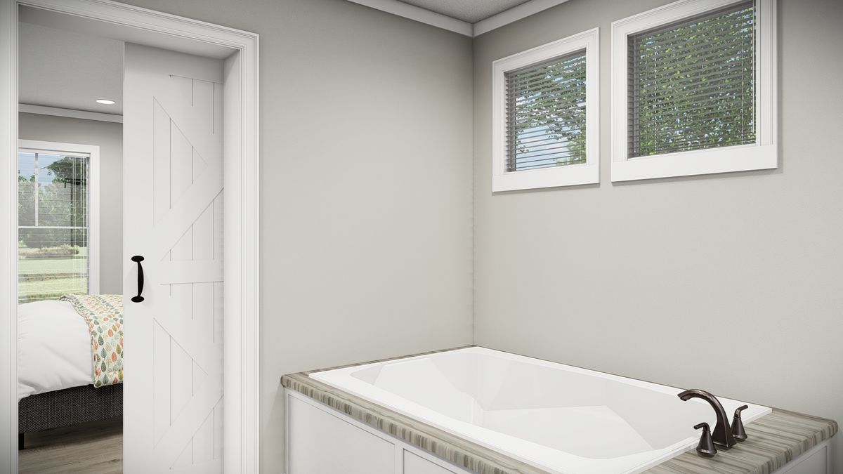 a18b479e-e3c0-47ea-b98a-d79521e9eb12 A rendering of a bathroom with a bathtub.
