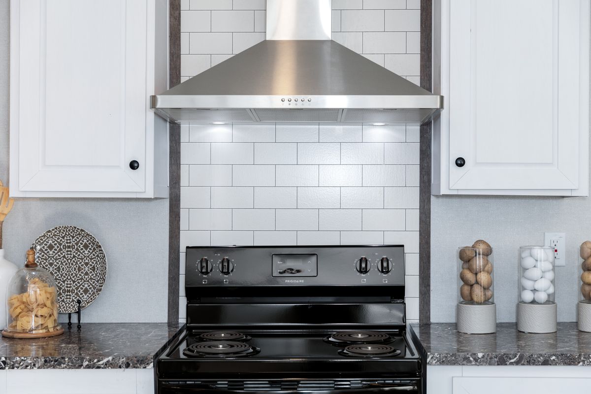 stainless steel appliances, white cabinets