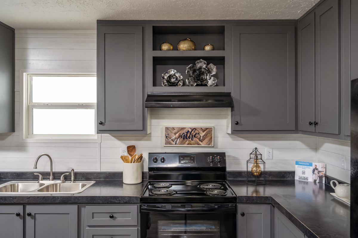 b4908c3a-0612-459c-98dc-1b2f21e06836 gray cabinets, black appliances