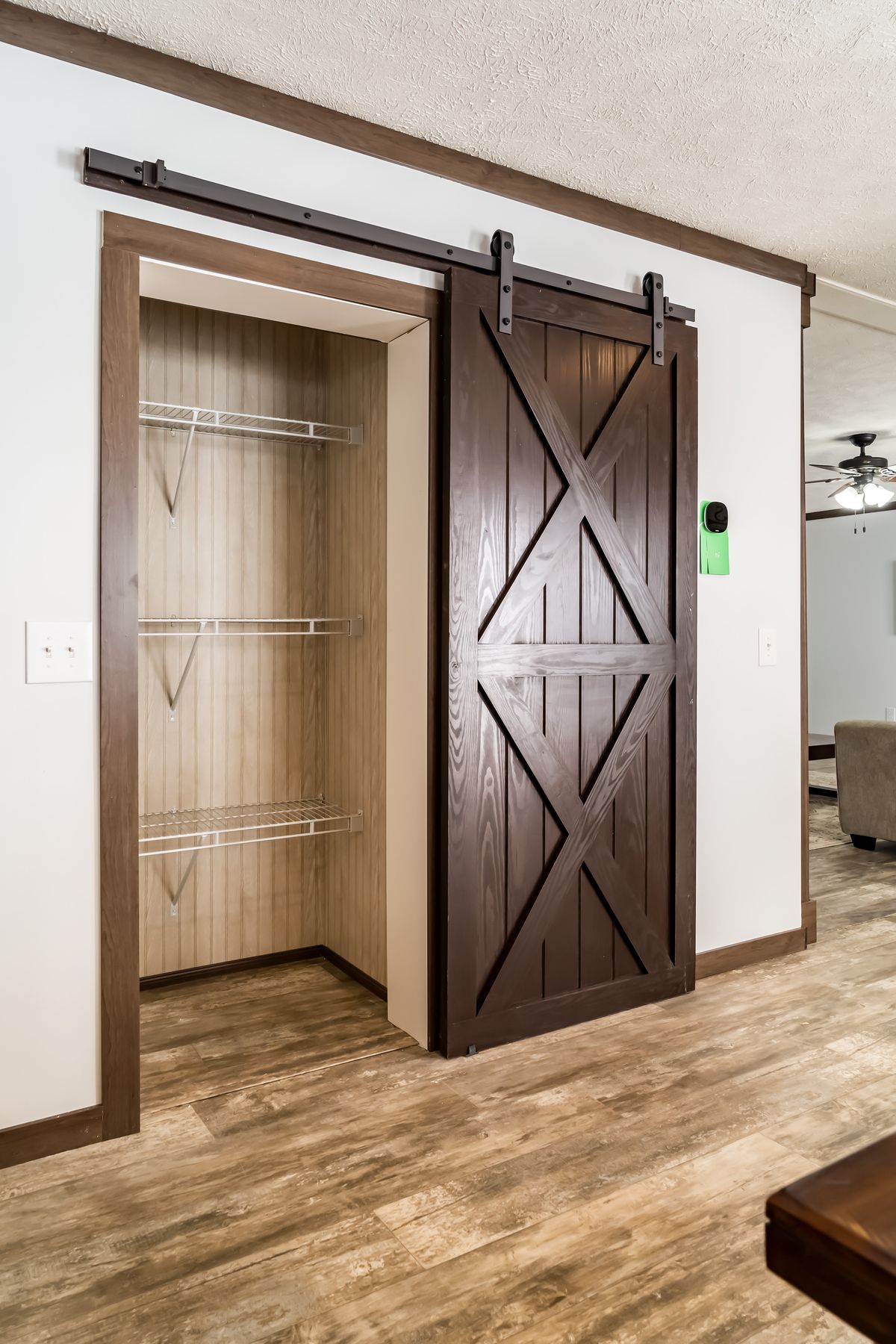 A sliding barn door in a living room.