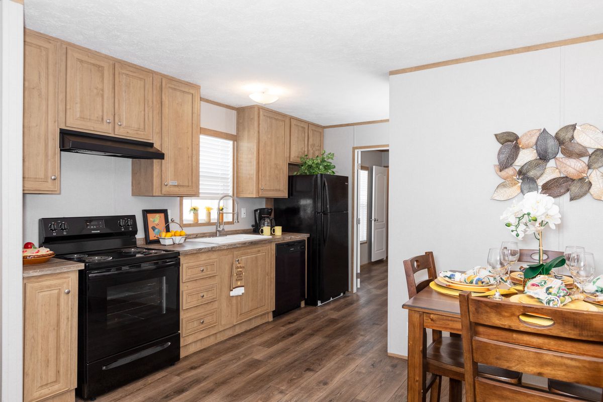 A kitchen and dining area in a mobile home.