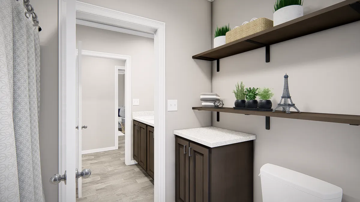 A bathroom with shelves and a toilet.