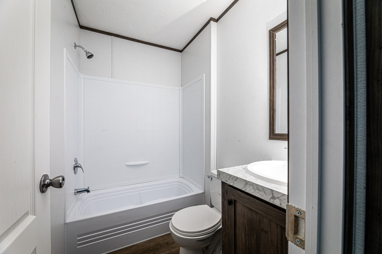 A small bathroom with a toilet and sink.