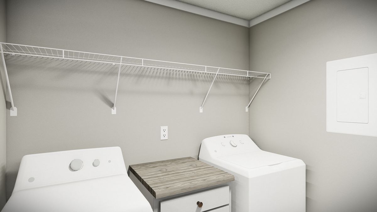 d077ae84-8047-46ca-b30d-53e55324e544 A laundry room with a washer and dryer.