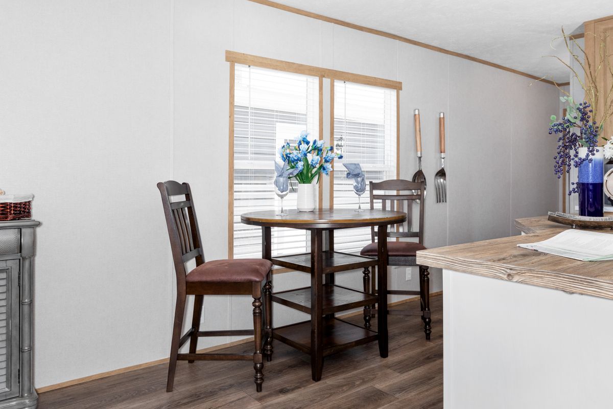 d952b32d-f34b-4d90-b278-70795859ac95 An image of a kitchen in a mobile home.