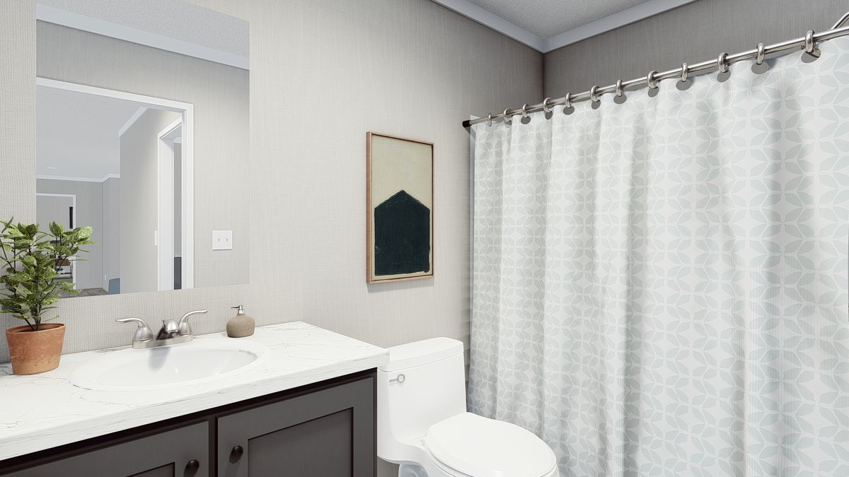 e4adfccd-1753-461d-b2af-de945b683c7e A bathroom with a toilet, sink and shower curtain.