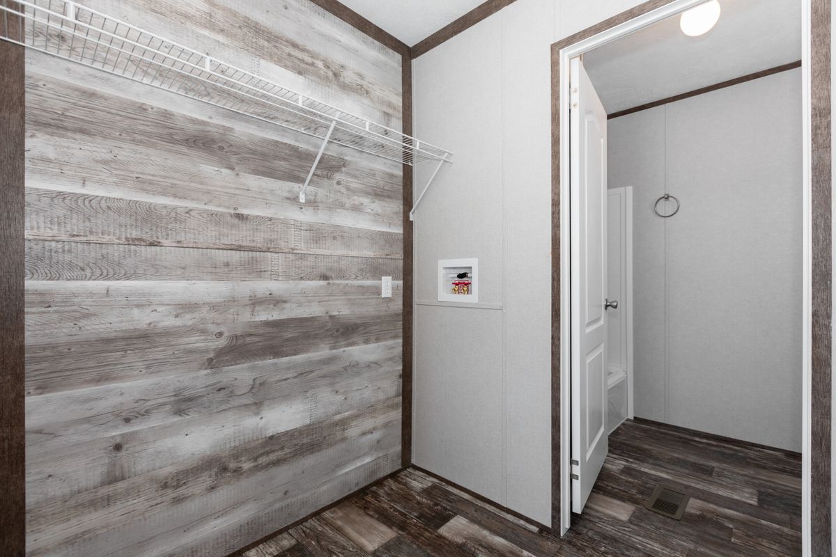 A walk in closet in a mobile home.