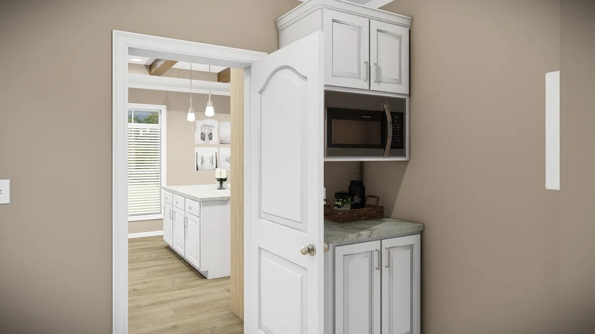 A kitchen with a microwave and a refrigerator.