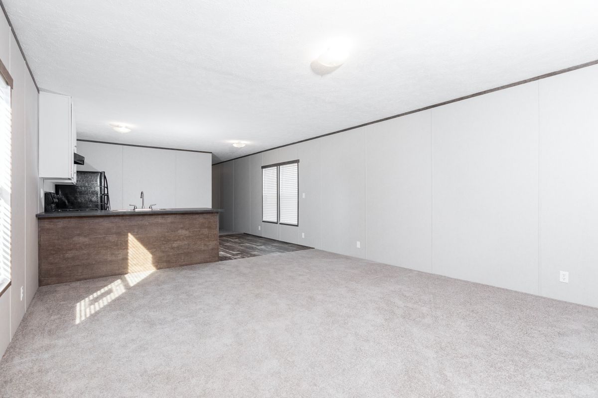 f223f260-c8a3-49a8-bd28-942d9d0a8700 Empty living room in a mobile home.