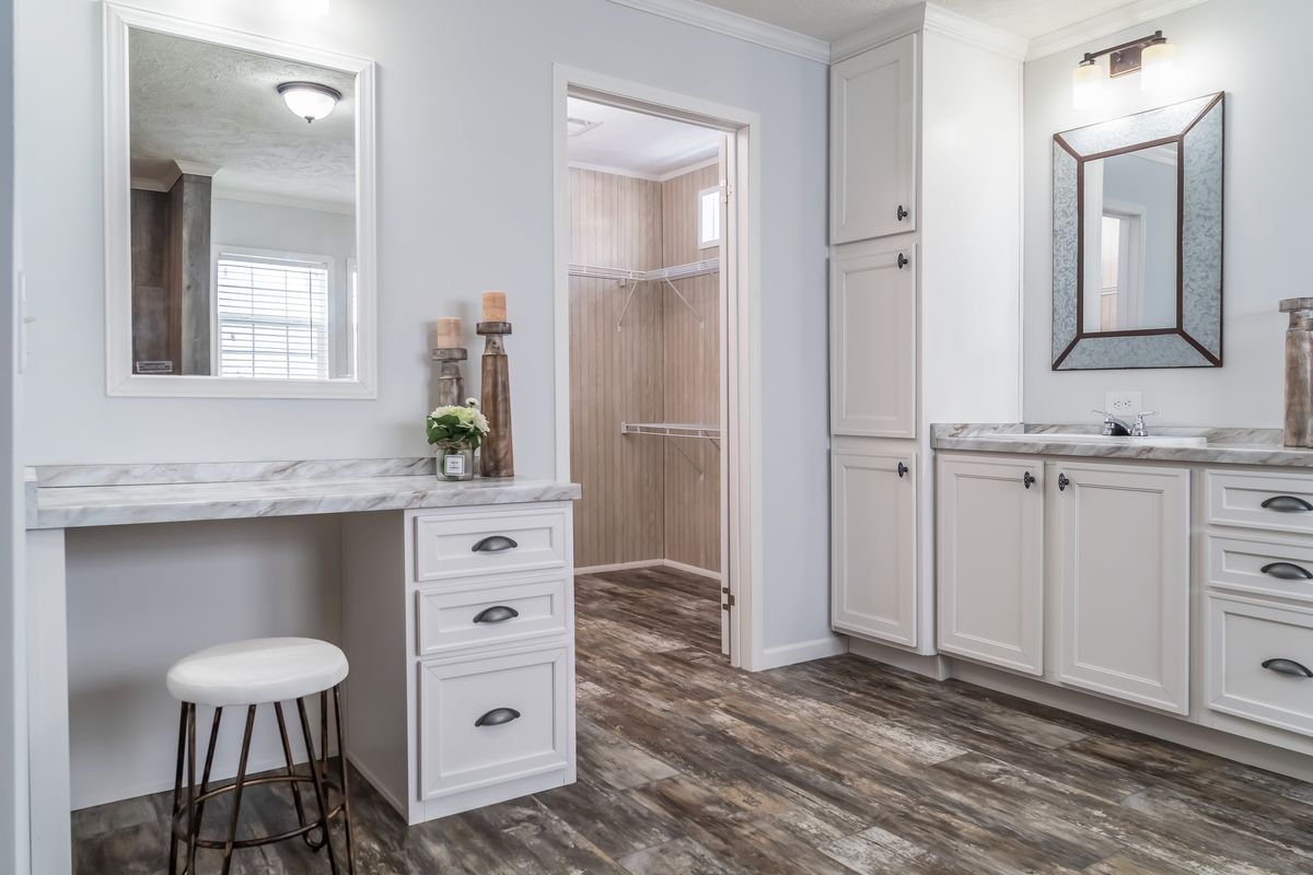 30CEE16682AHClayton Waycross Facility 930 A white bathroom with wood floors and a vanity.