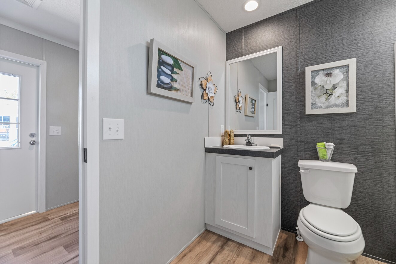 the_clarke_52769979664_o_1679953657213_1323_12 A small bathroom with a toilet and sink.