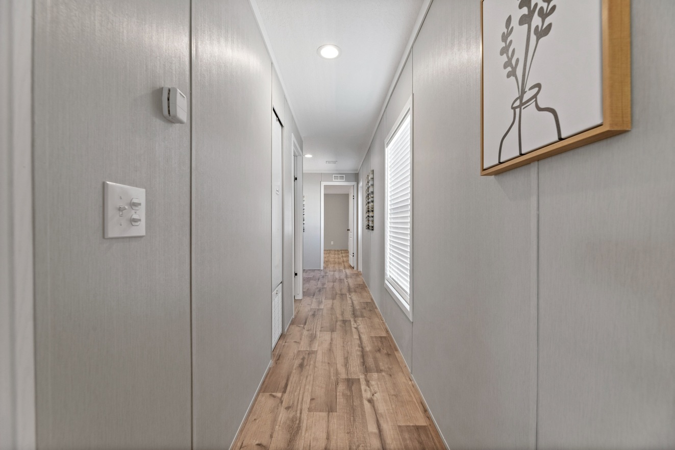 the_clarke_52770138845_o_1679953496125_1323_12 An image of a hallway in a mobile home.