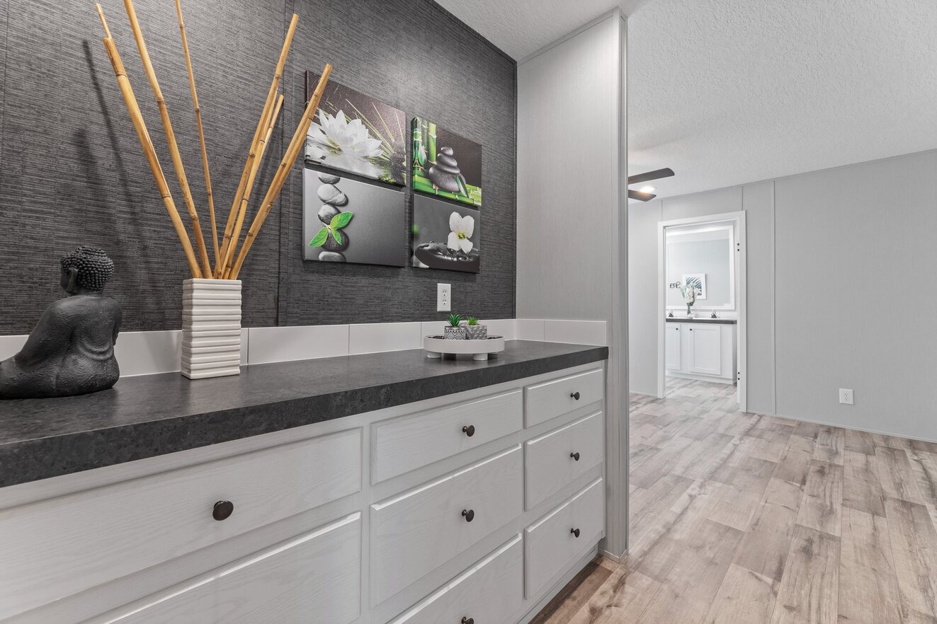 the_clarke_52770214303_o_1679953470124_1323_12 A black and white bathroom with a wooden counter top.