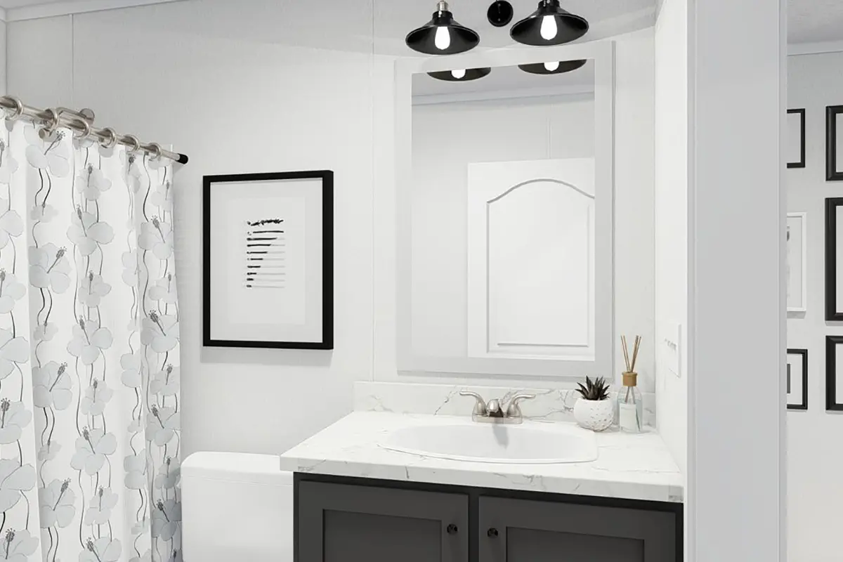 A bathroom with a sink and a mirror.