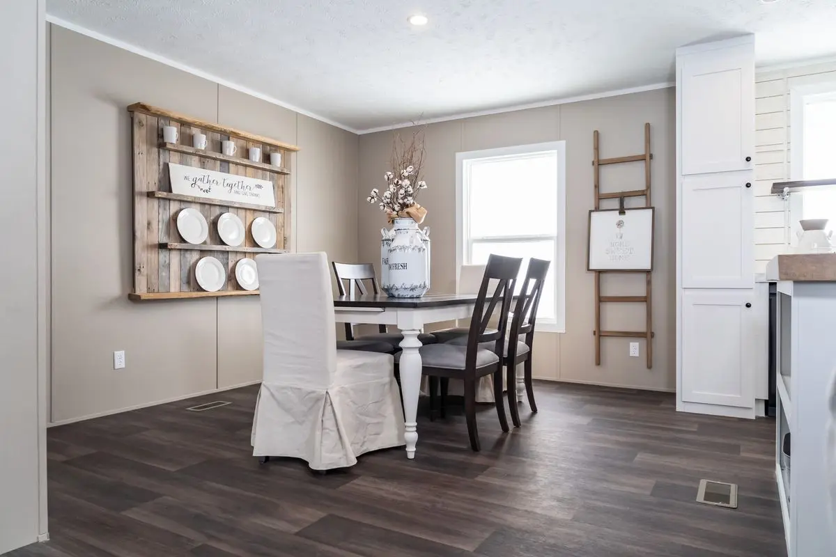 A dining table and chairs in a kitchen.