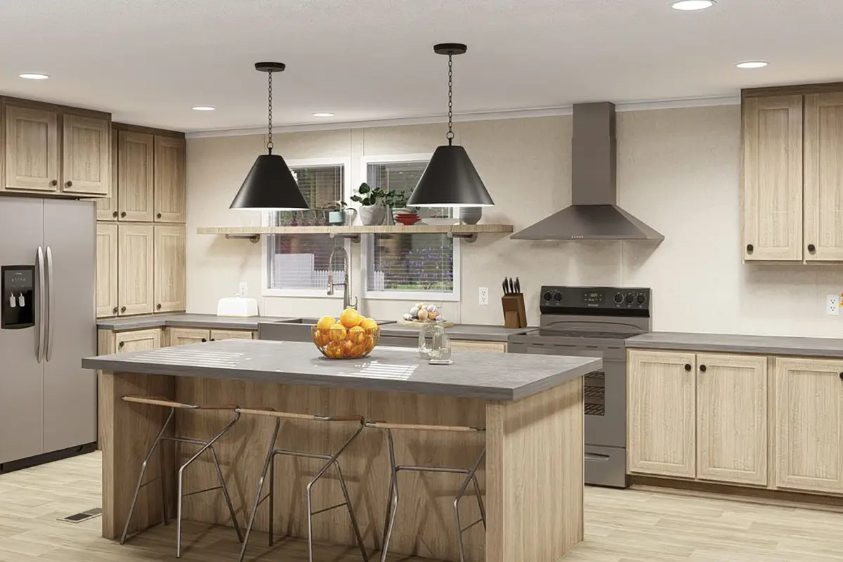 A kitchen with a large island and a large sink.