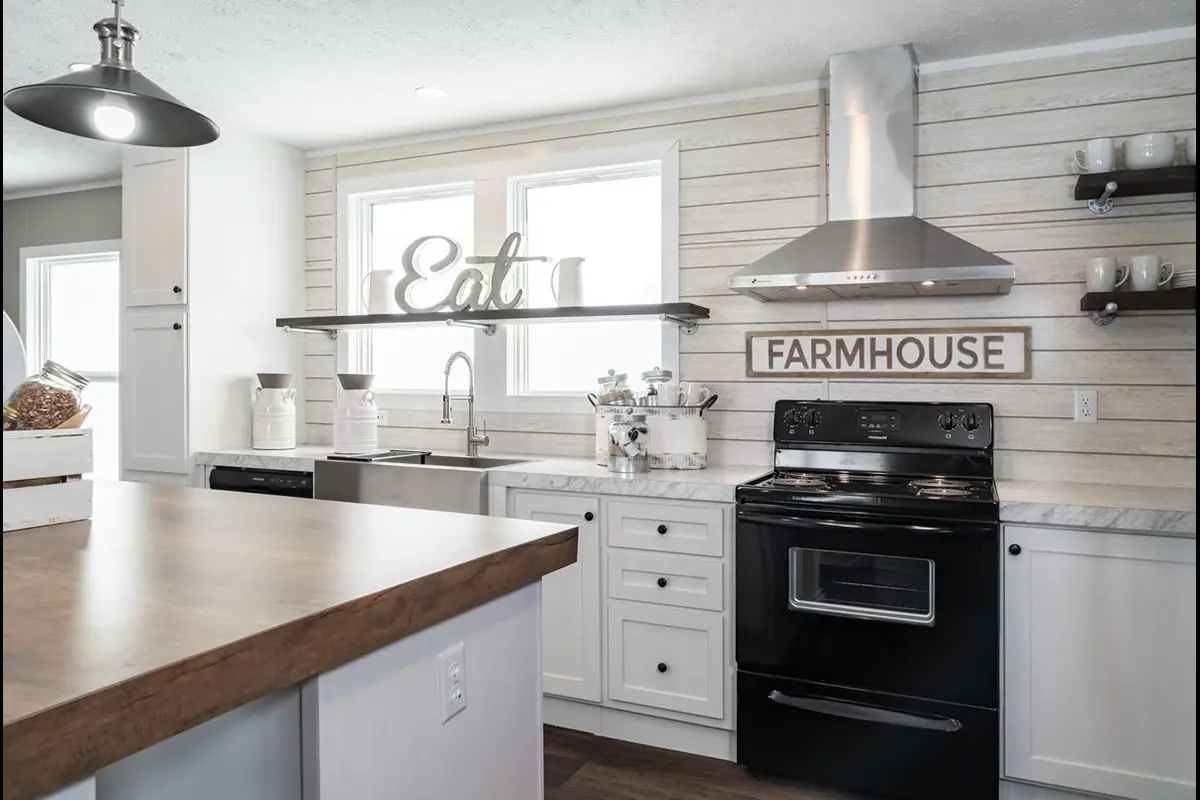 A kitchen with a stove and a wood countertop.