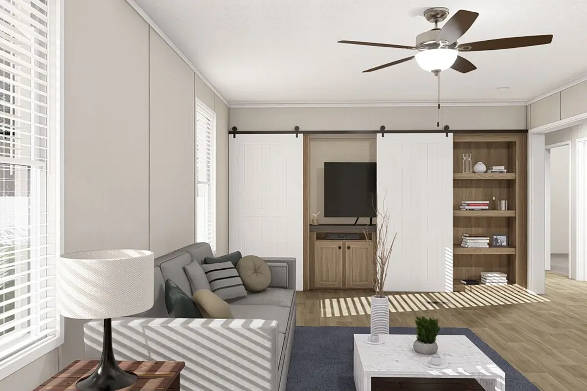 A living room with a fan and a couch.