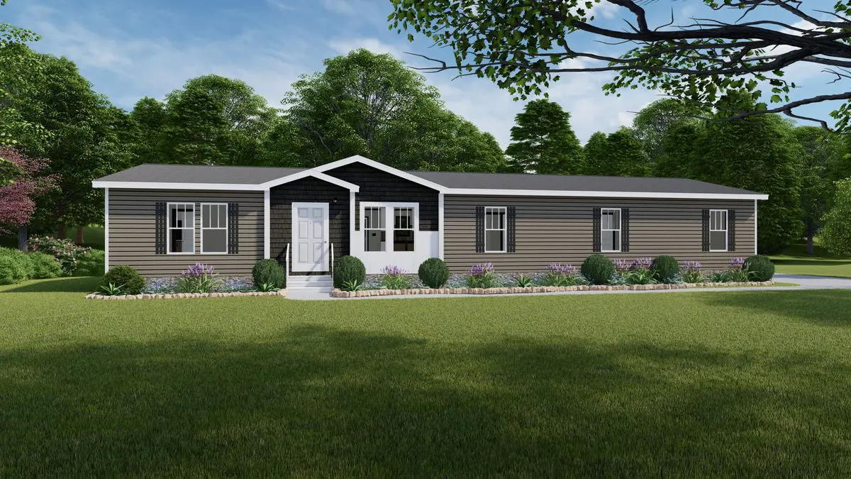 2bcd0208-1d14-439f-83eb-b13499527075 A single-story, gray modular home with white trim, surrounded by a manicured lawn and flowering shrubs, set against a backdrop of trees and a clear sky.