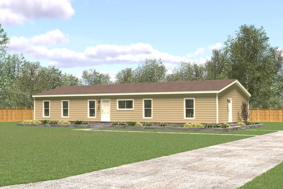 Single-story beige manufactured home with a brown roof, surrounded by green grass and landscaping, with a concrete driveway leading to the entrance.