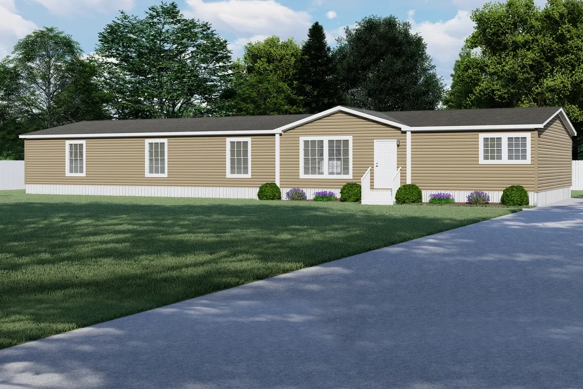 Single-story beige manufactured home with white trim, a small front porch, shrubs, and a paved driveway, surrounded by green lawn and trees.