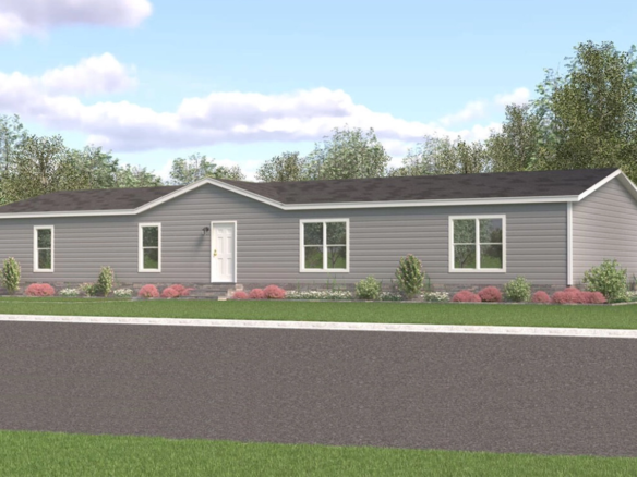 Single-story grey manufactured home with white trim, black roof, three front windows, and a white front door. The house is surrounded by landscaping and faces a paved street.