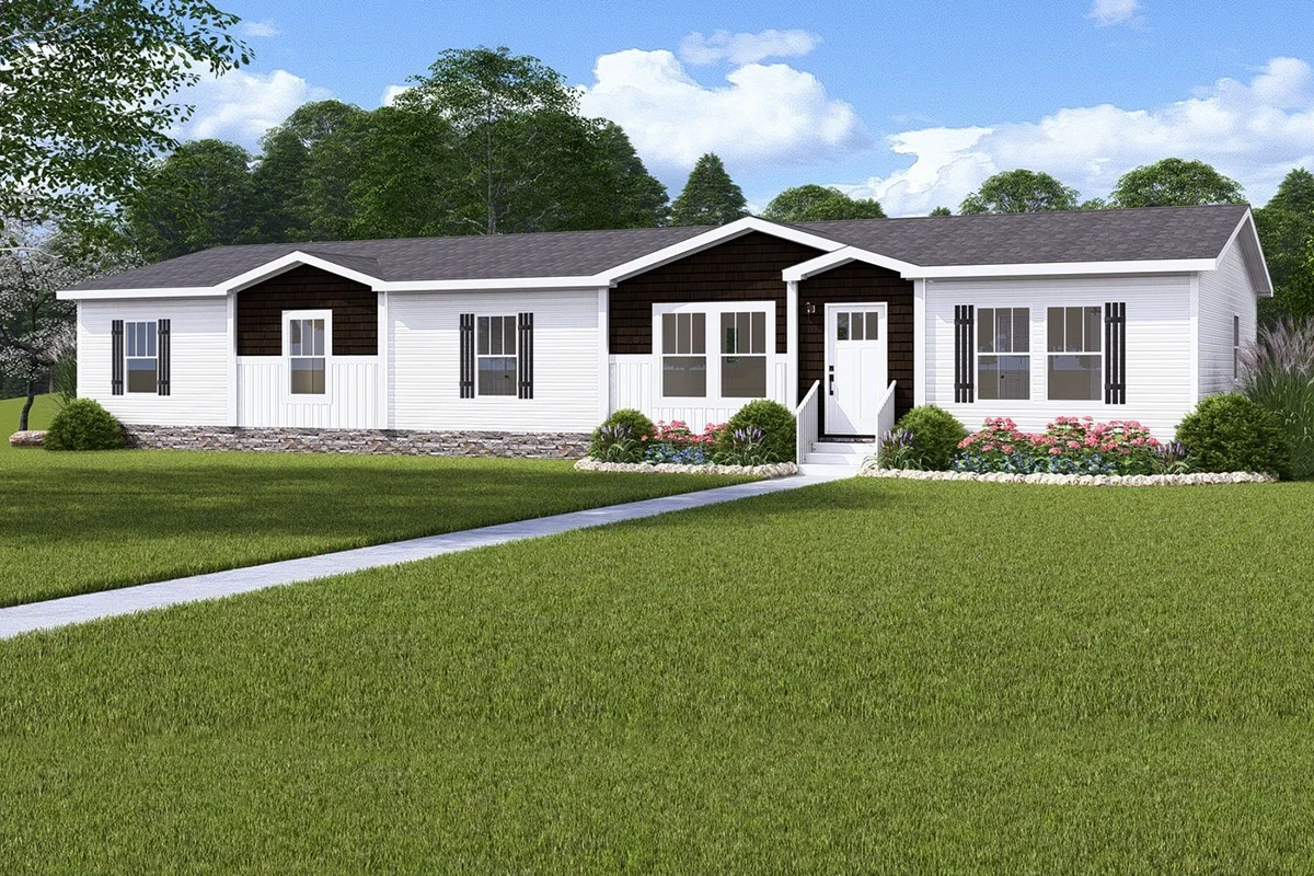 980a9ad4-6b13-4e8d-b3cc-99bccdfd75ed A single-story, white manufactured home with dark trim, large windows, a front door with a small porch, surrounded by green lawn and landscaping under a blue sky.