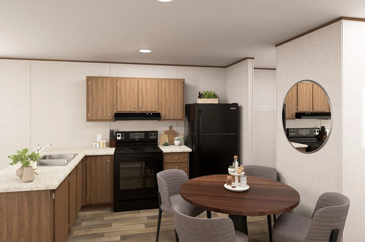 00b43c67-8823-4e22-950c-b8f3f4701224 Modern kitchen with wood cabinets, black appliances, round dining table with four chairs, and a round wall mirror. Countertops have a plant and various kitchen items.
