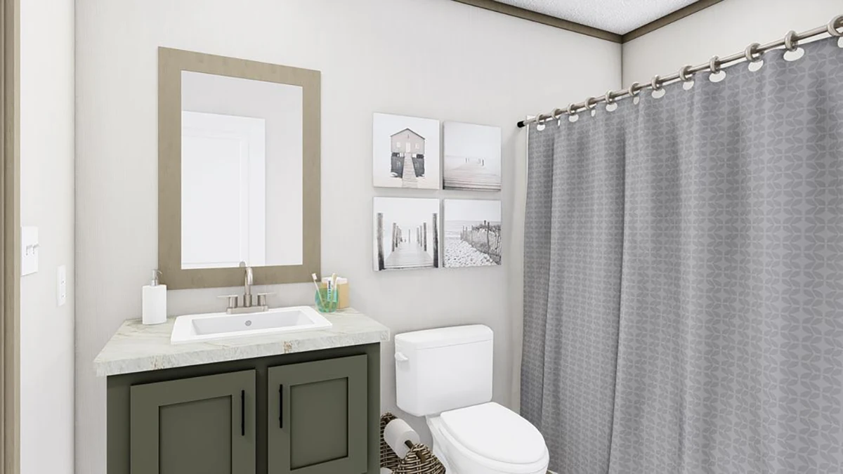 Modern bathroom with a sink and vanity, wall mirror, toilet, basket, four wall art pieces, and a shower with a gray patterned curtain.