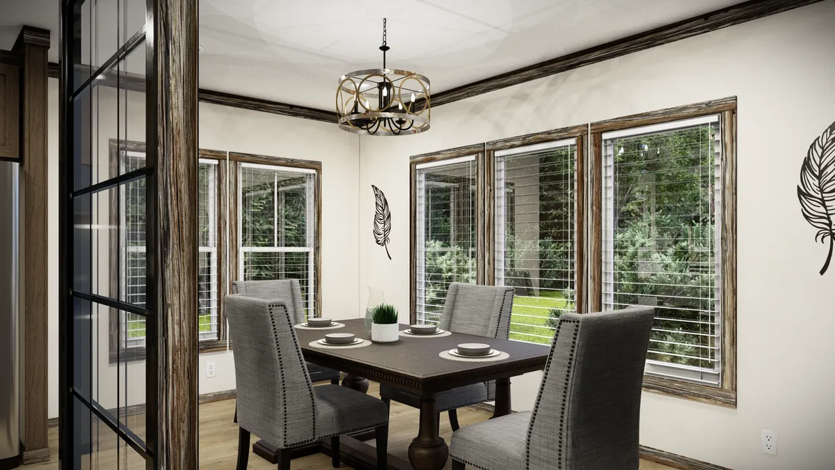 0483912b-3bce-464c-b6cd-3b212ac78473 A dining room with a rectangular table set for four, gray upholstered chairs, large windows with blinds, wall art, and a modern chandelier.