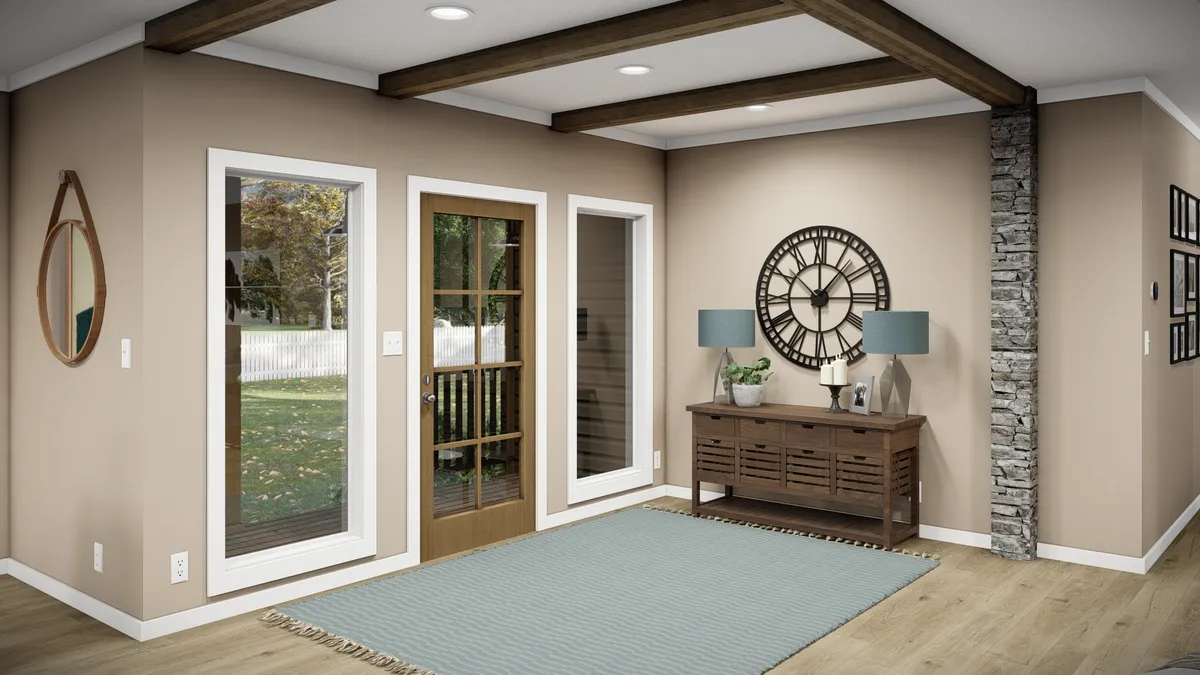 0bef290d-a1de-45a7-80f8-d600425bed3c Modern entryway with beige walls, wood beams, and a large clock above a console table with two lamps; glass door and windows let in natural light.