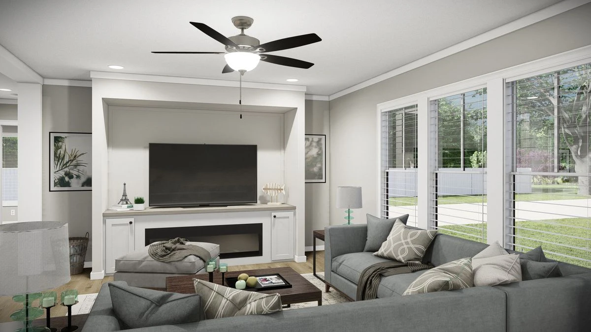 12029a03-7ad3-49ad-ac97-0178725eacde A modern living room with gray sectional sofas, a coffee table, a TV on a white console, large windows with blinds, and a ceiling fan with lights.