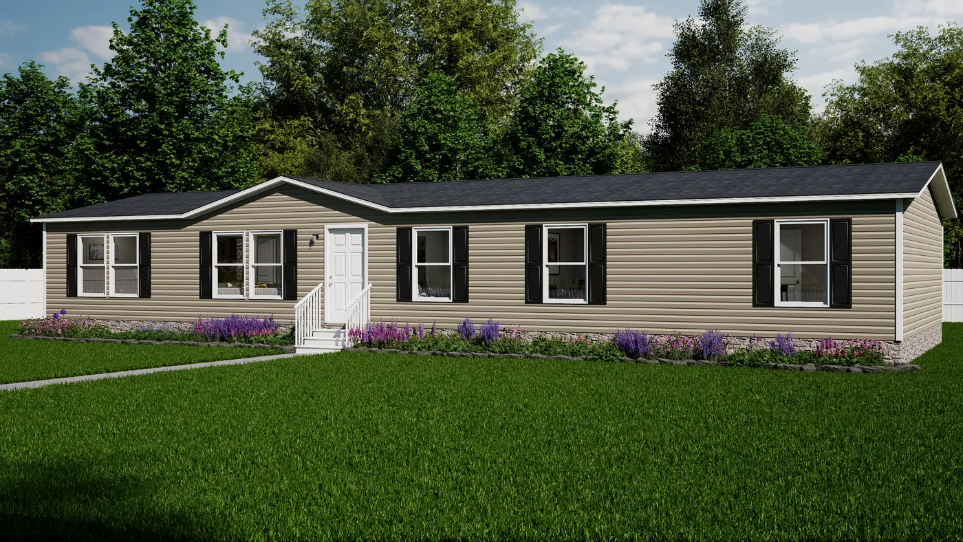 12f33bb0-a7d0-4d2b-b67c-ef5fdeb03add A single-story beige manufactured home with black shutters, white trim, and a small porch is set on a green lawn with purple flowers and trees in the background.