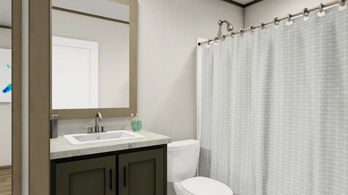 195d323a-5f42-4a03-a990-092793d73dfe A modern bathroom with a sink, mirror, dark vanity, toilet, and a shower with a patterned white curtain.