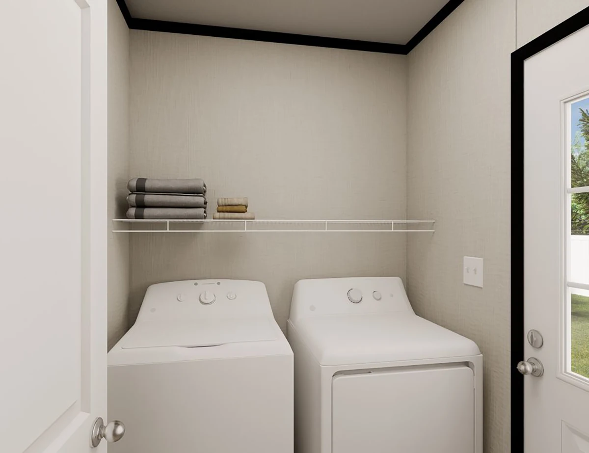 1c115bea-feb0-4ee0-a98a-d24208732275 A laundry room with a washing machine, a dryer, a wire shelf above them holding folded towels, and a door with a window showing a view outside.