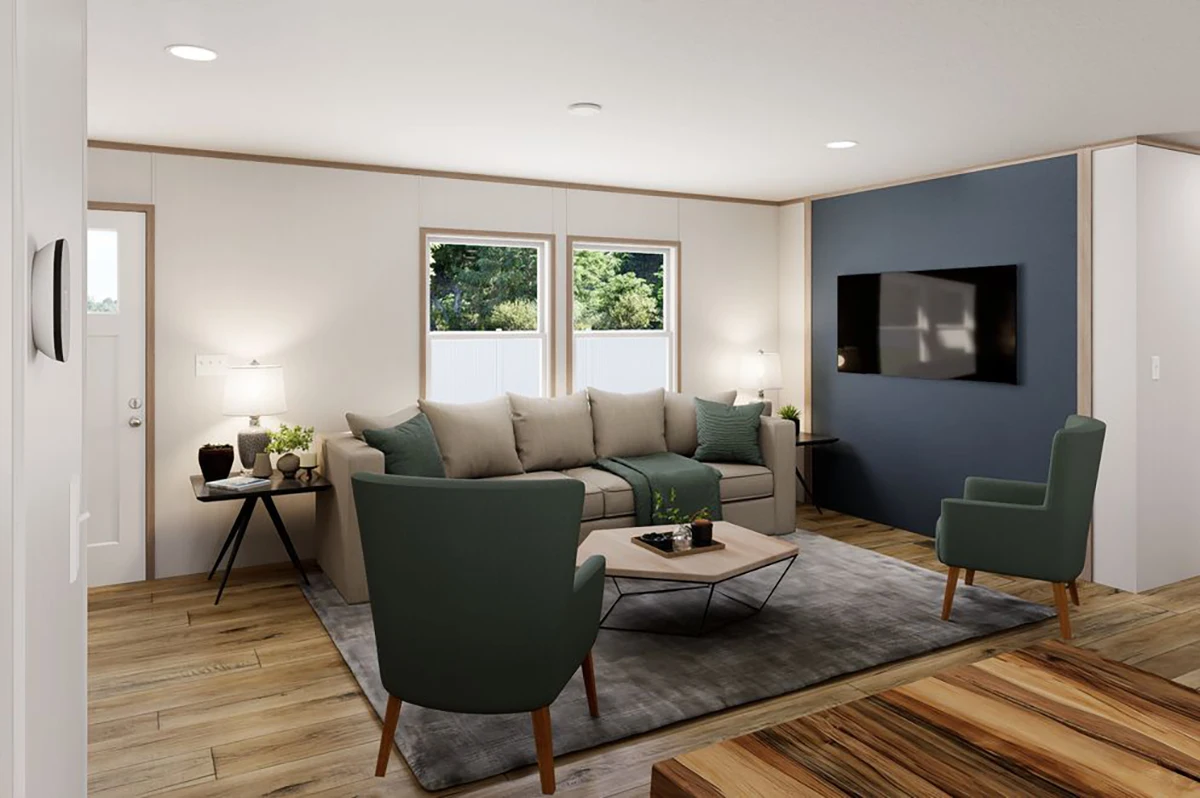 2b3b585b-142b-4c14-8cda-c1c583960f84 Modern living room with a gray sectional sofa, two green armchairs, a wall-mounted TV, two windows, wooden floors, and a gray rug.