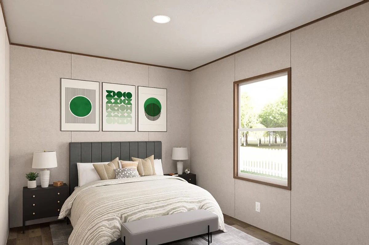 2e728c81-004a-48c0-b65e-305de2f8d33a A modern bedroom with a neatly made bed, two nightstands with lamps, three abstract green artworks above the bed, and a window letting in natural light.